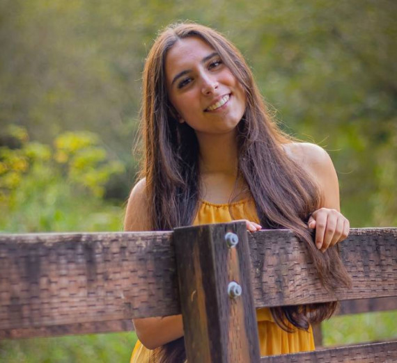 4 students of the GUide Core group speaking to an audience.